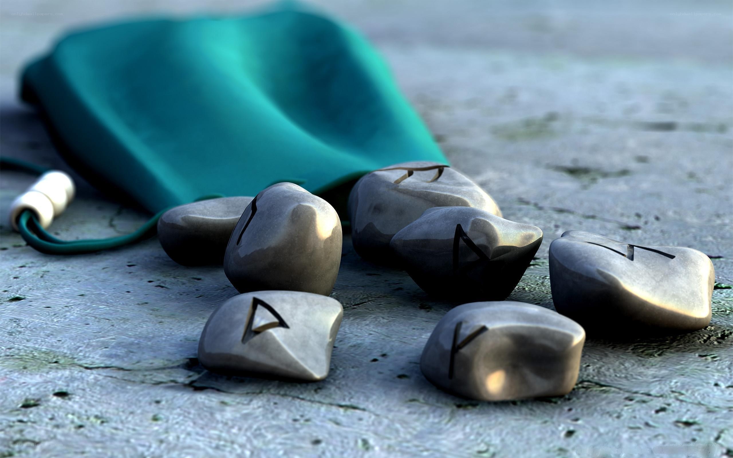 Rune stones on stone surface