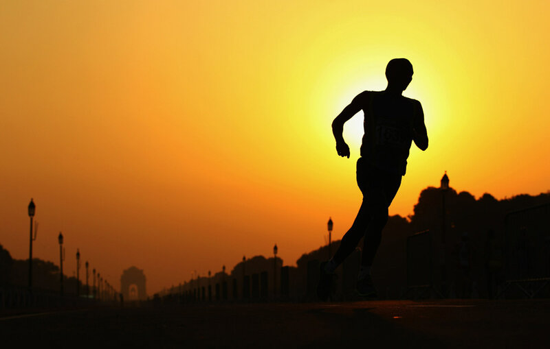 Runner at sunset silhouette