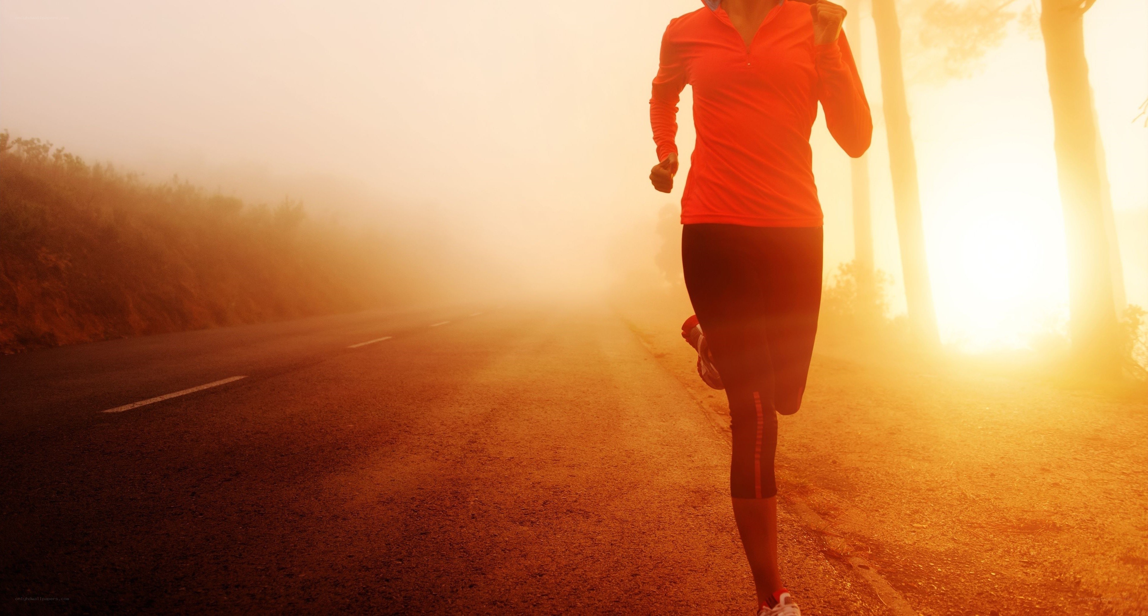 Runner on a foggy road