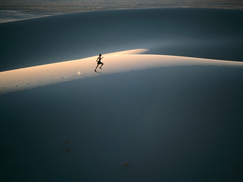 Runner on a sand dune