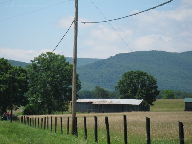 rural barn with mountains