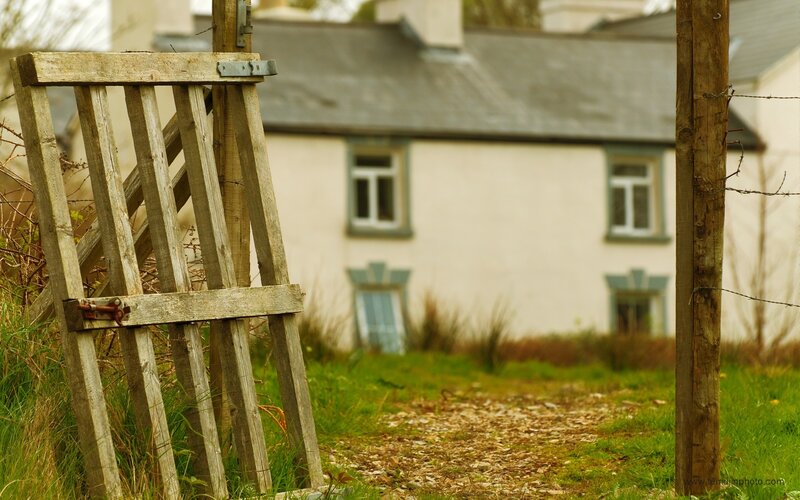 Rural cottage with wooden gate