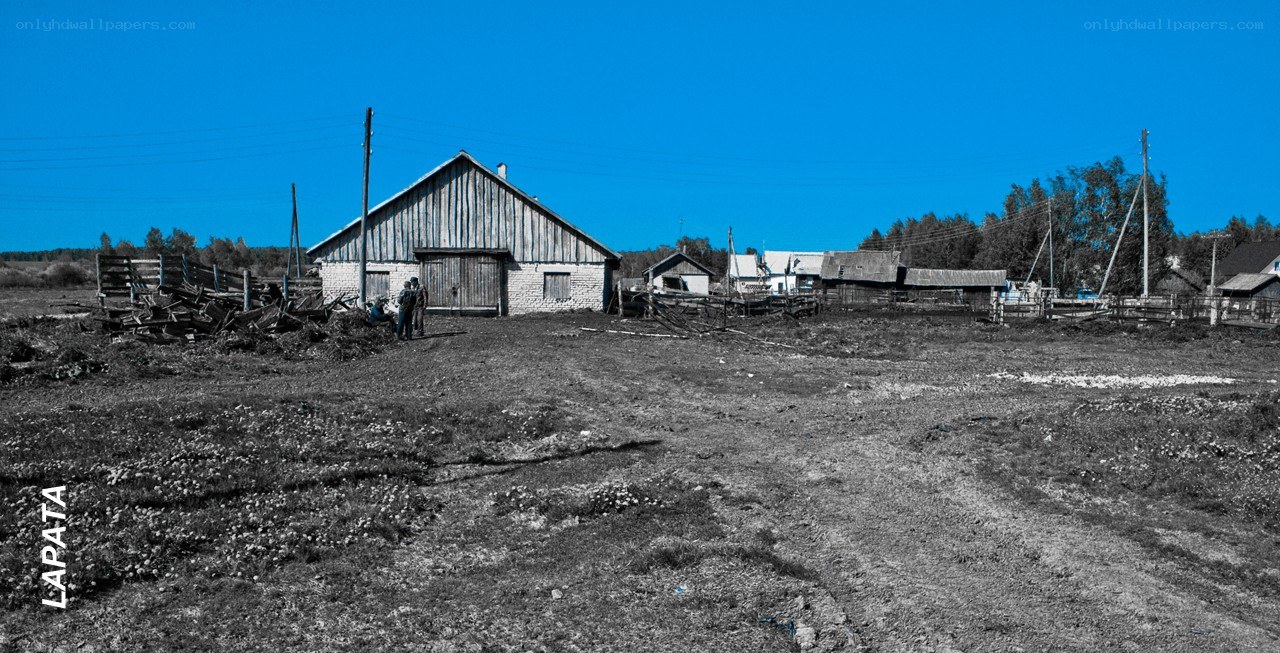 Rural farmstead under blue sky
