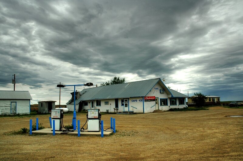 Rural gas station under stormy sky