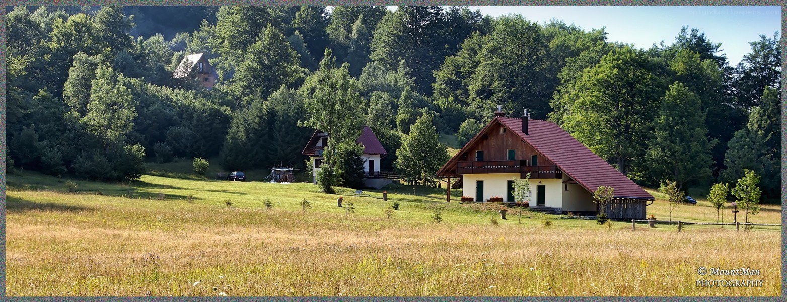 Rural house in a forested valley
