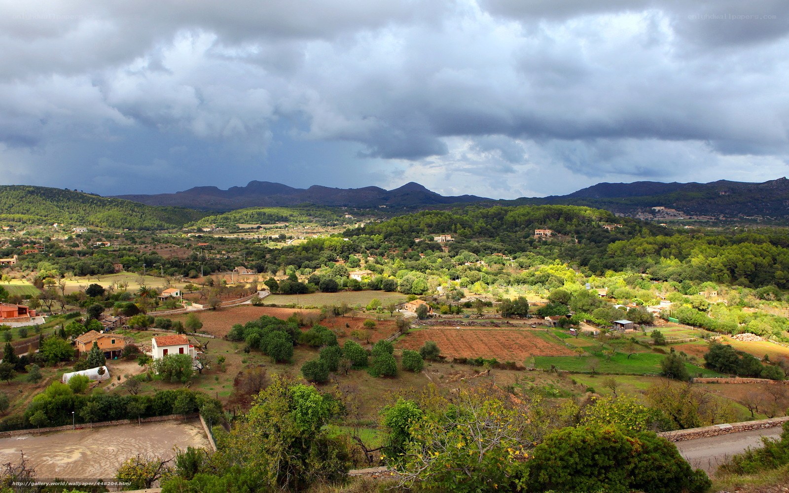 Rural landscape under stormy sky
