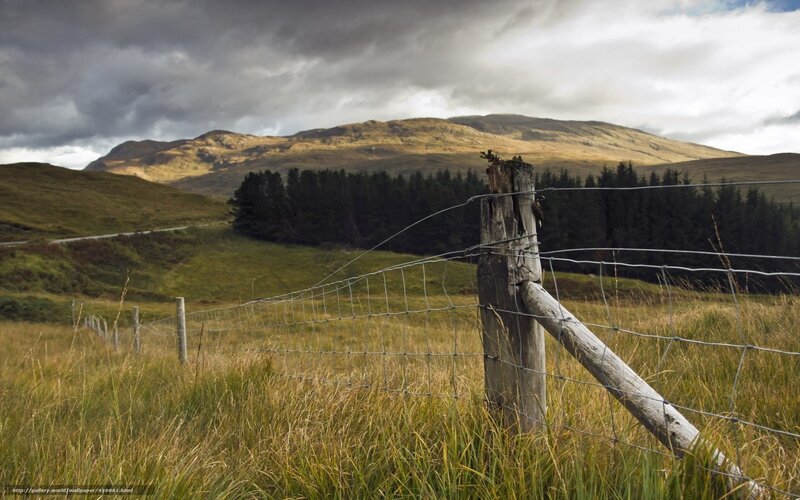 Rural landscape with fence and hills