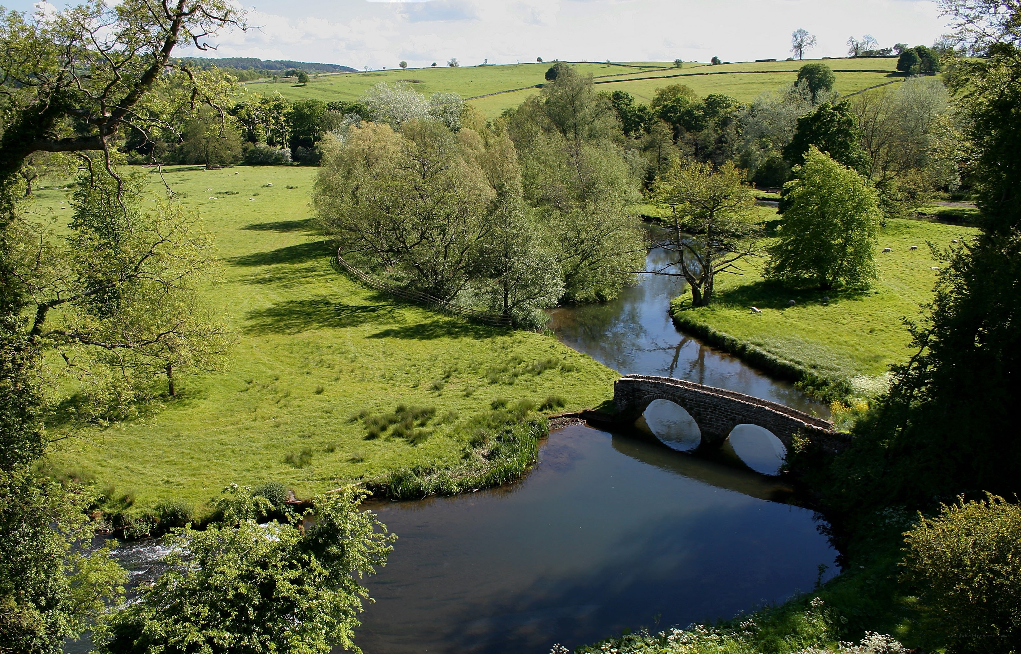rural river with stone bridge