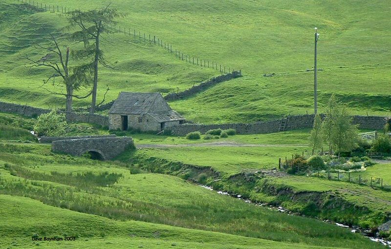 rural stone cottage in green hills