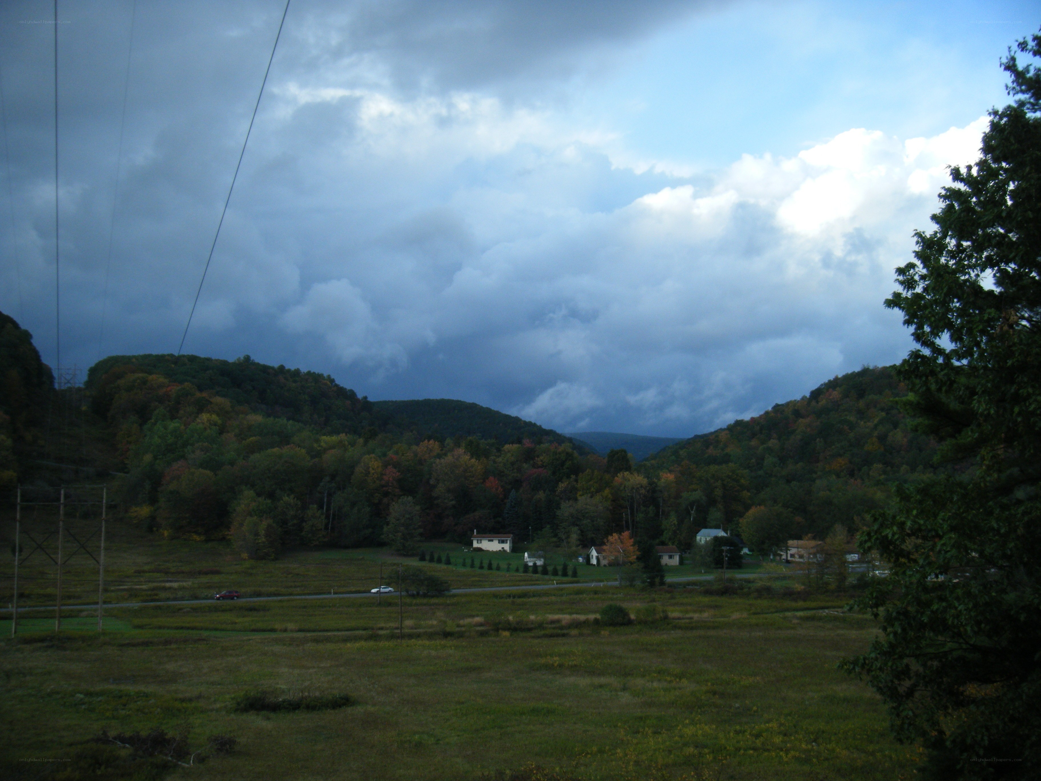 rural valley under stormy sky