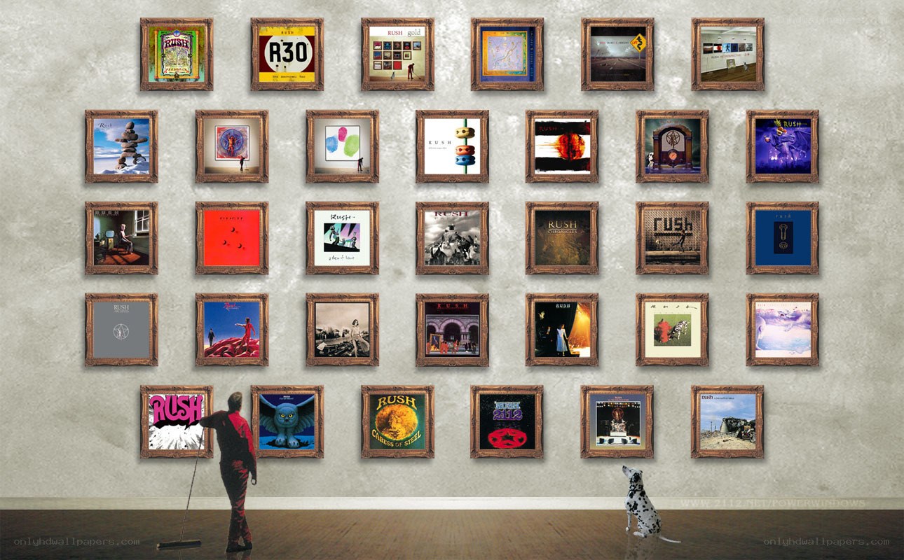 Rush album covers on a wall