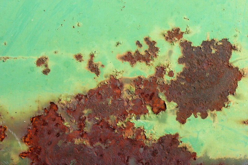 rust on green metal surface