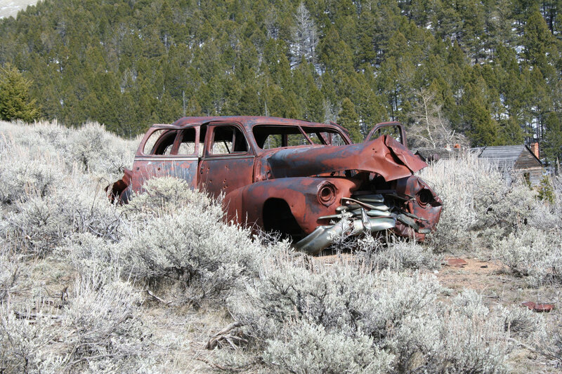 Rusted car in a field