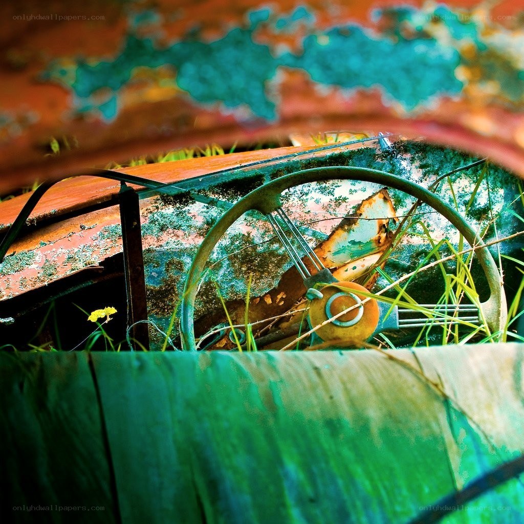 Rusted car interior with steering wheel