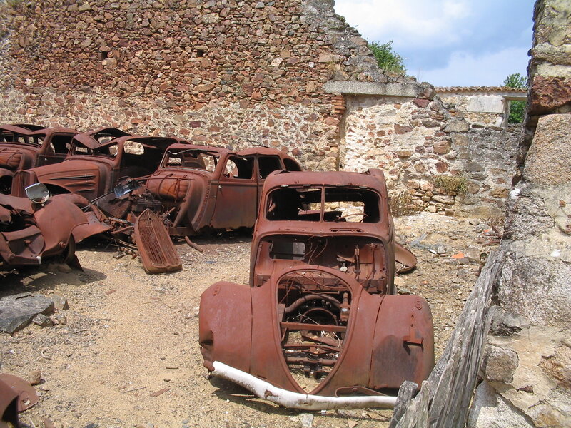 Rusted cars in old ruins
