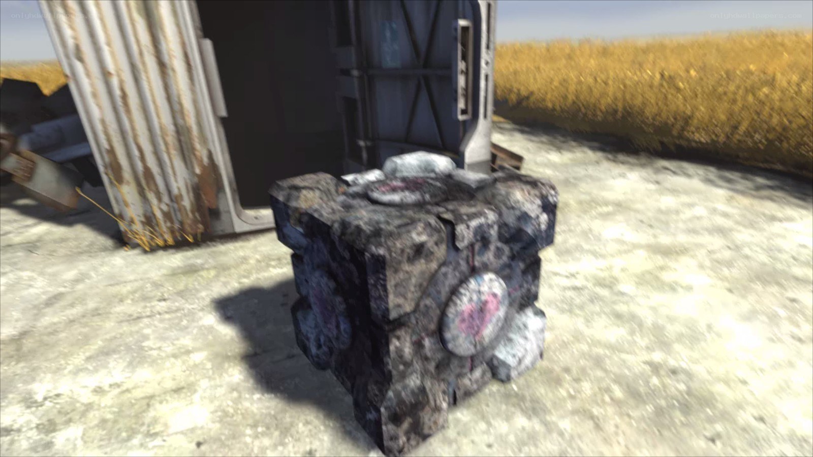 rusted cube in field
