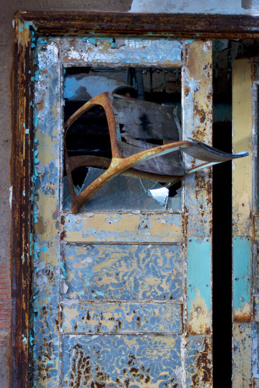 Rusted door with broken window