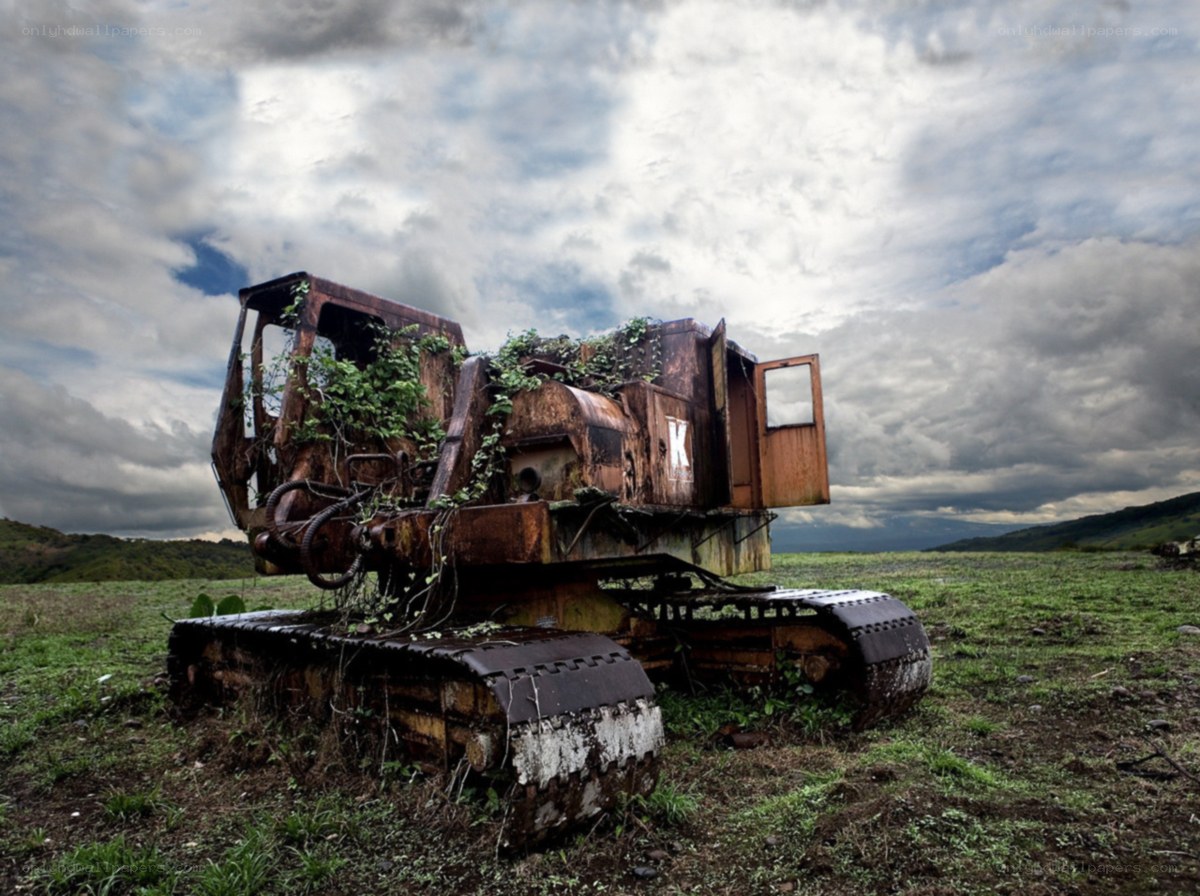 Rusted excavator in a field