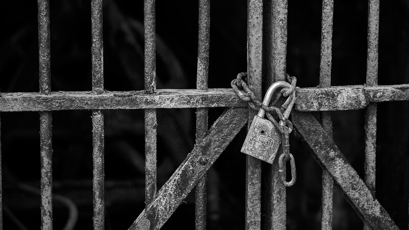 Rusted Padlock on Gate