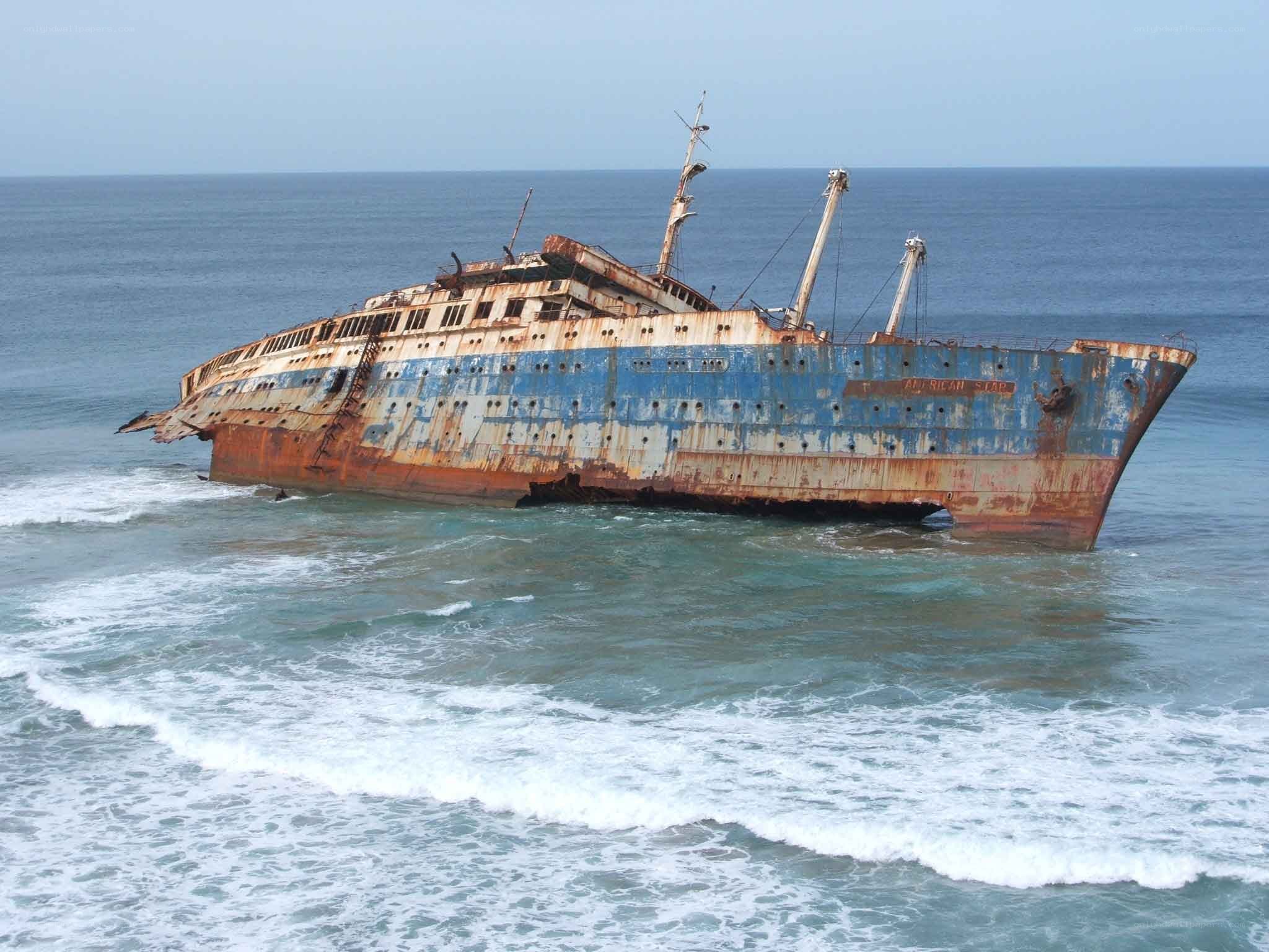 Rusted shipwreck on shore