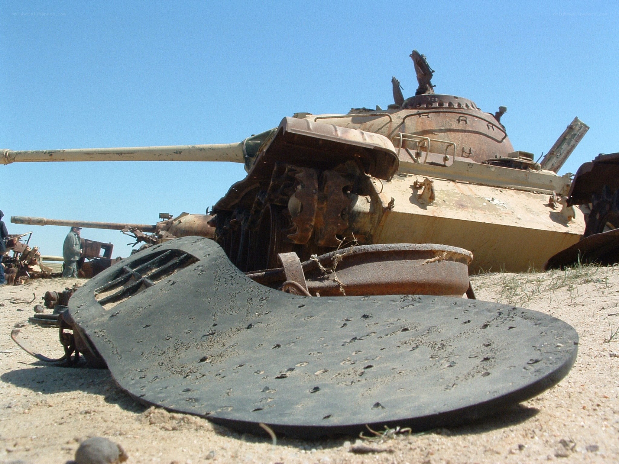Rusted tank in desert scrapyard