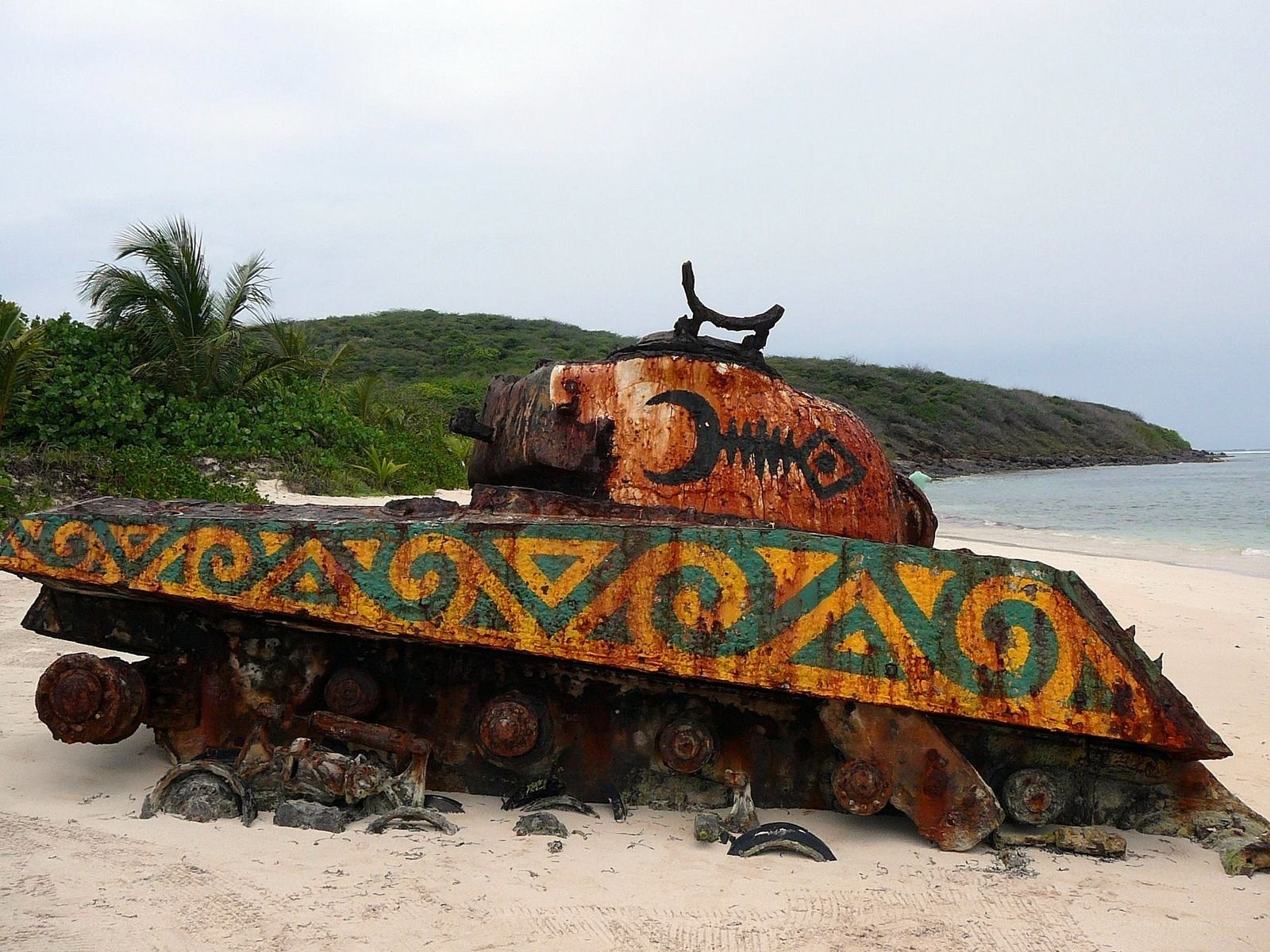 Rusted tank on tropical beach