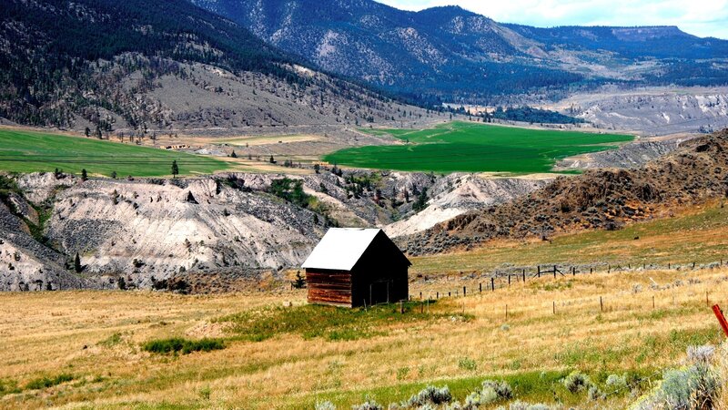 Rustic barn in mountain valley
