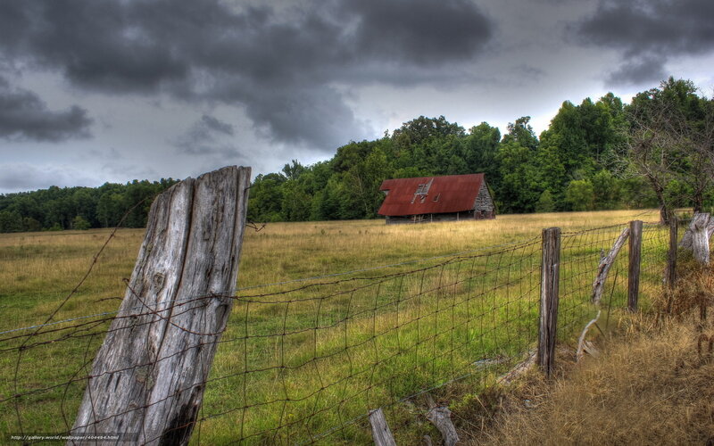 Rustic barn under stormy sky