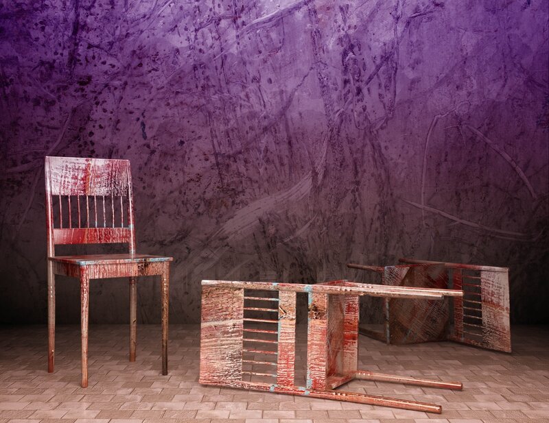 Rustic chairs against purple wall