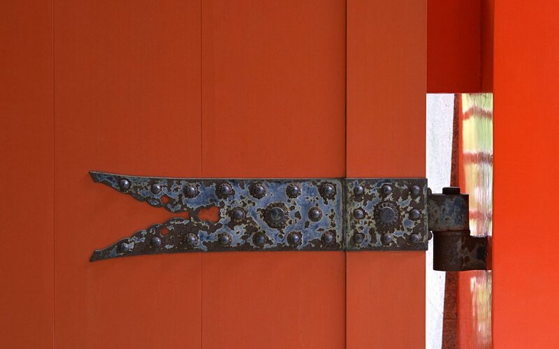 rustic hinge on red door