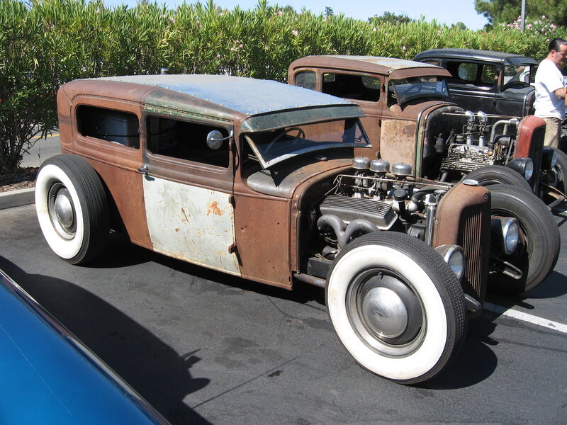Rustic hot rod cars at a show