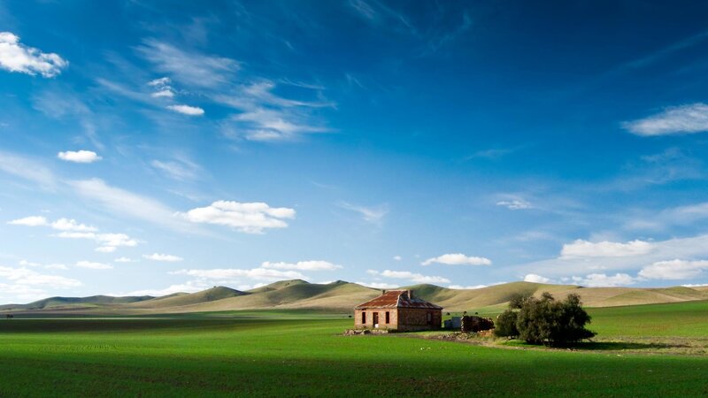 Rustic house in green fields