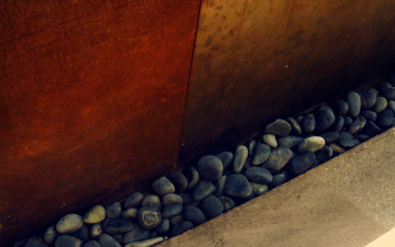 Rustic metal and pebbles