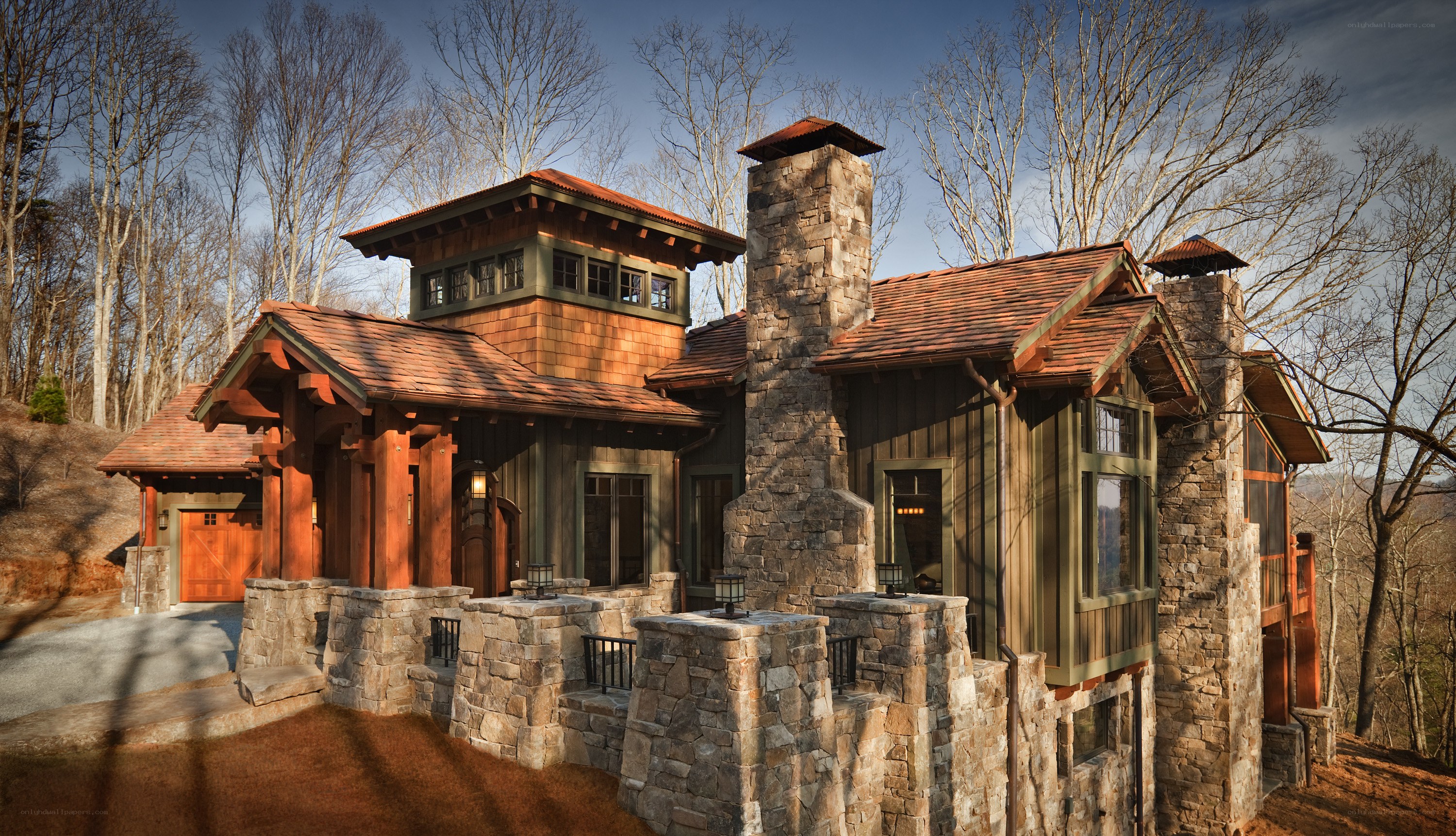 rustic mountain home with stone chimney