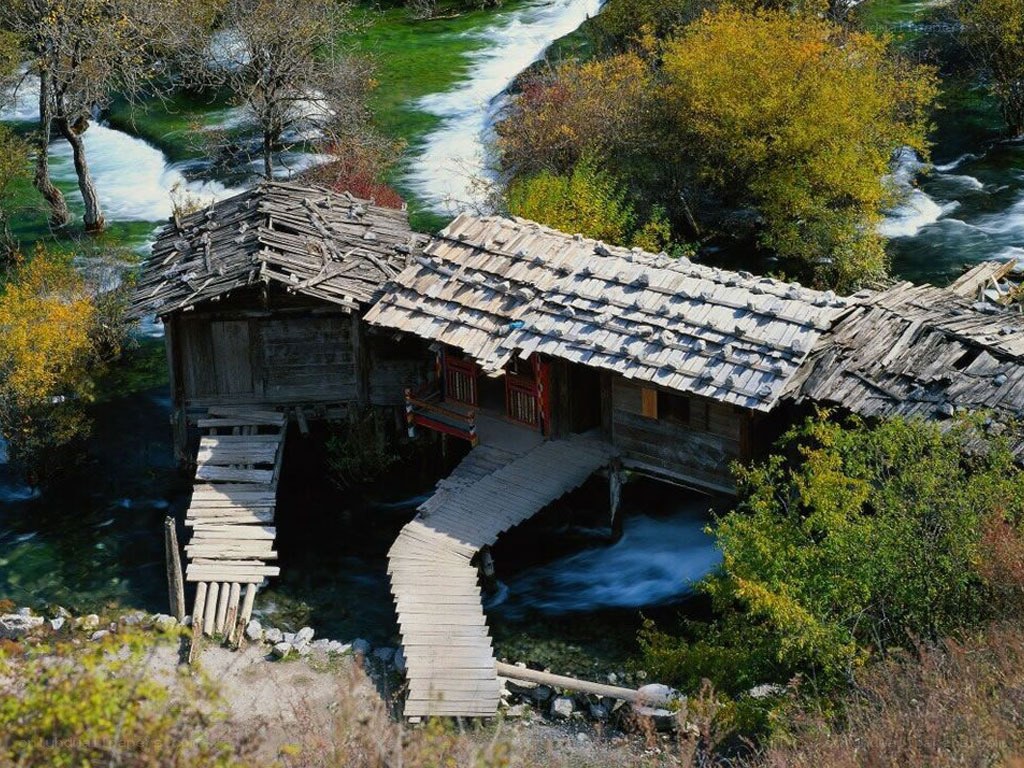 Rustic river houses in autumn