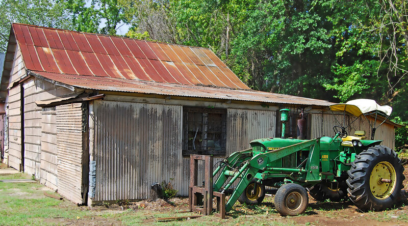 Rustic shed with green tractor