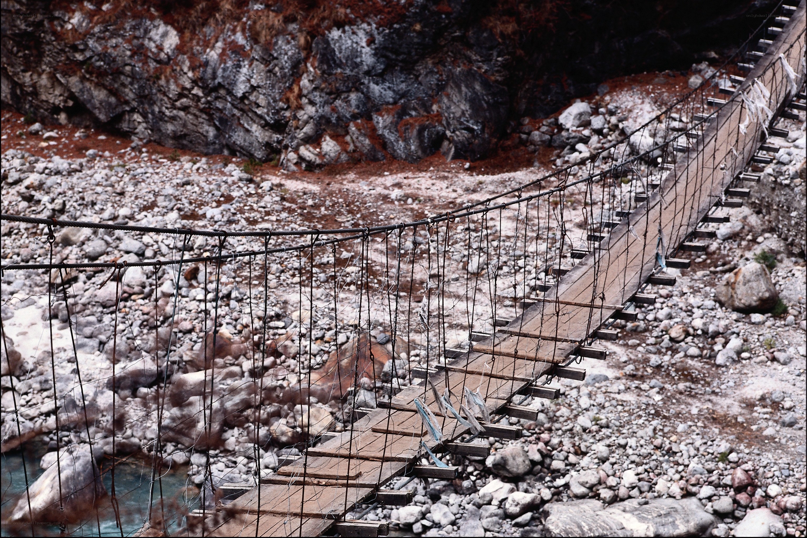 Rustic suspension bridge over river