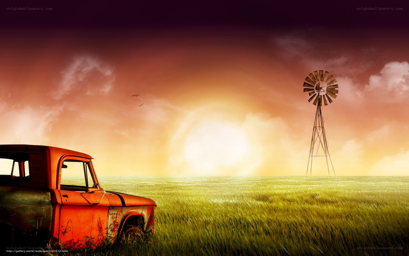 Rustic truck and windmill at sunset