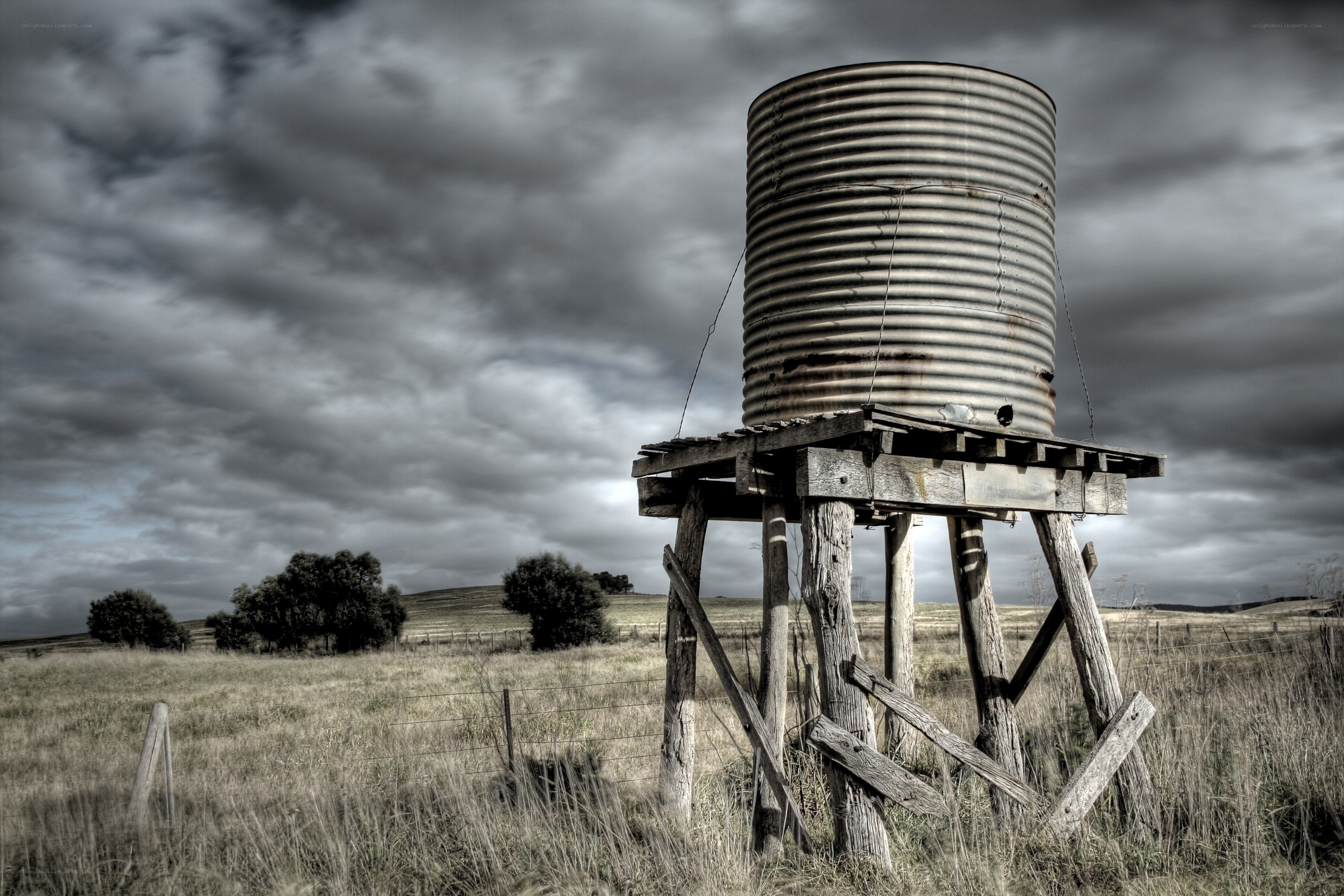 Rustic water tank in a field