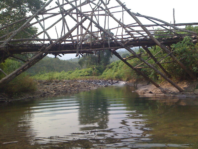 Rustic wooden bridge over river
