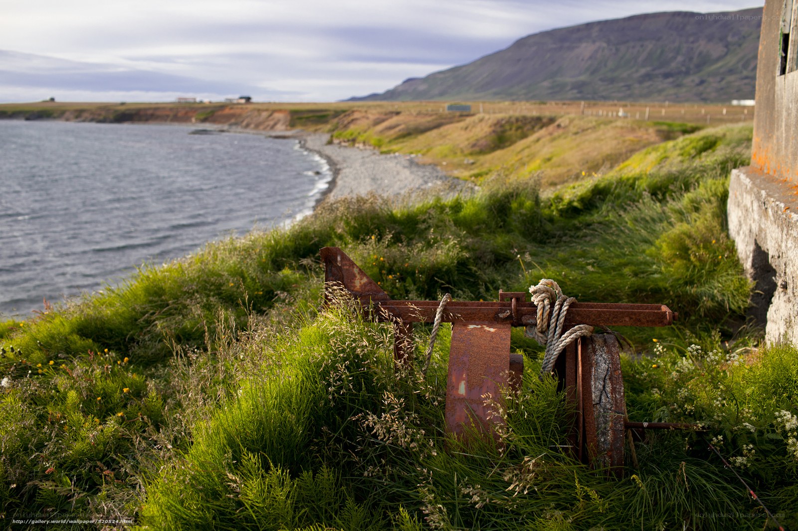 Rusty anchor on a coastal cliff
