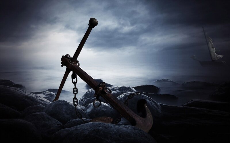 Rusty Anchor on Rocks