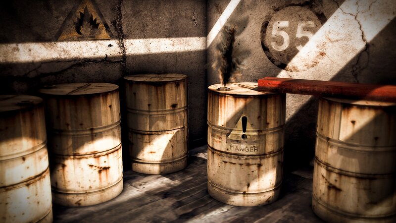 Rusty barrels in a dimly lit room