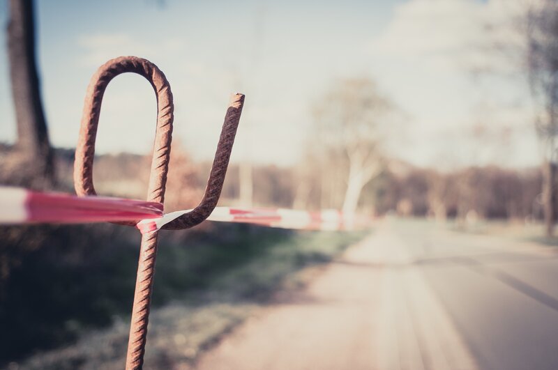 Rusty barrier on a quiet road