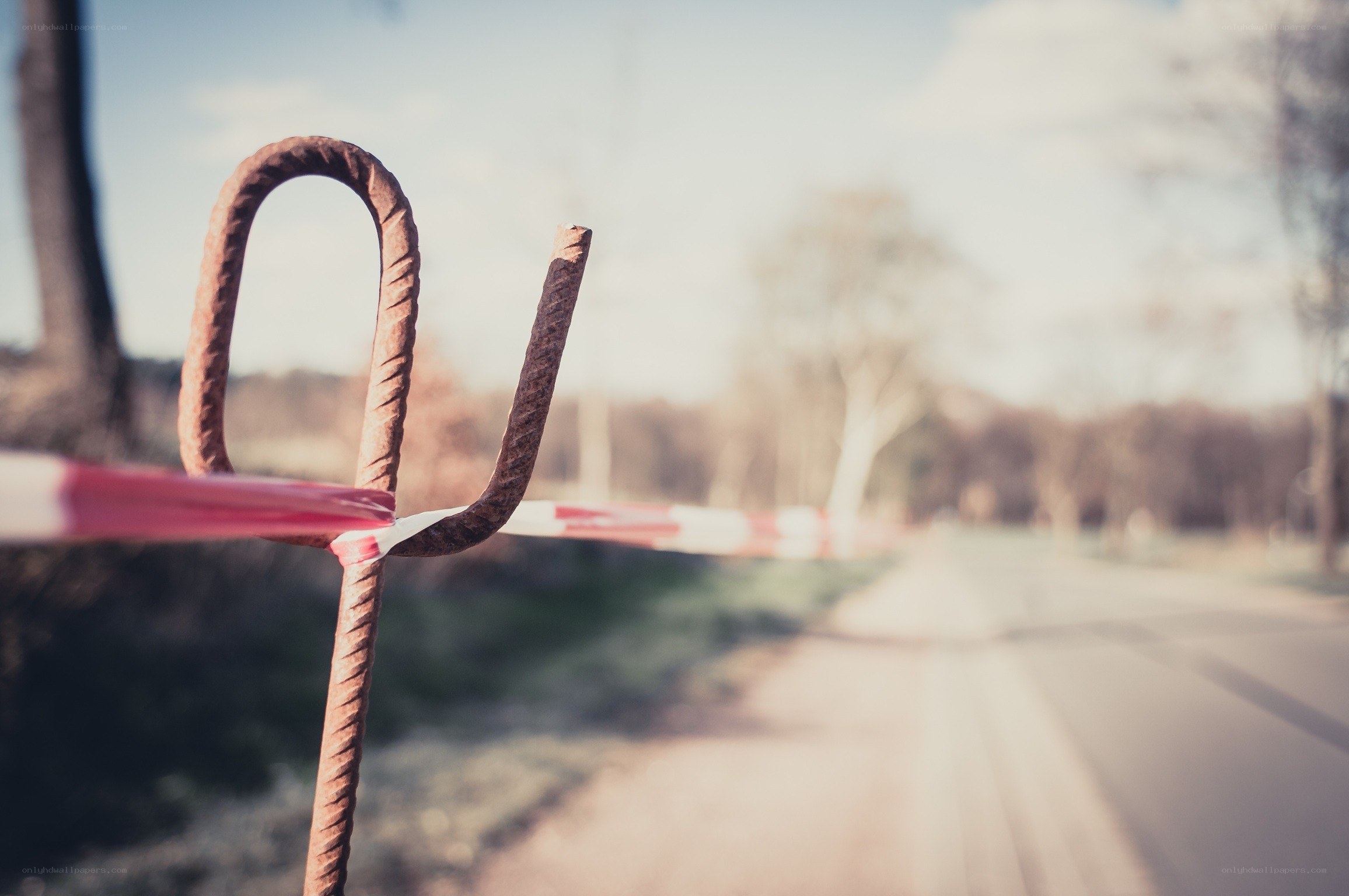 Rusty barrier on a quiet road