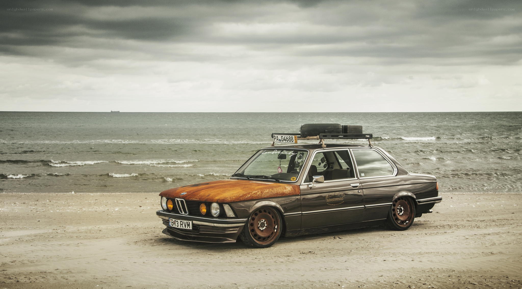 Rusty BMW on the beach
