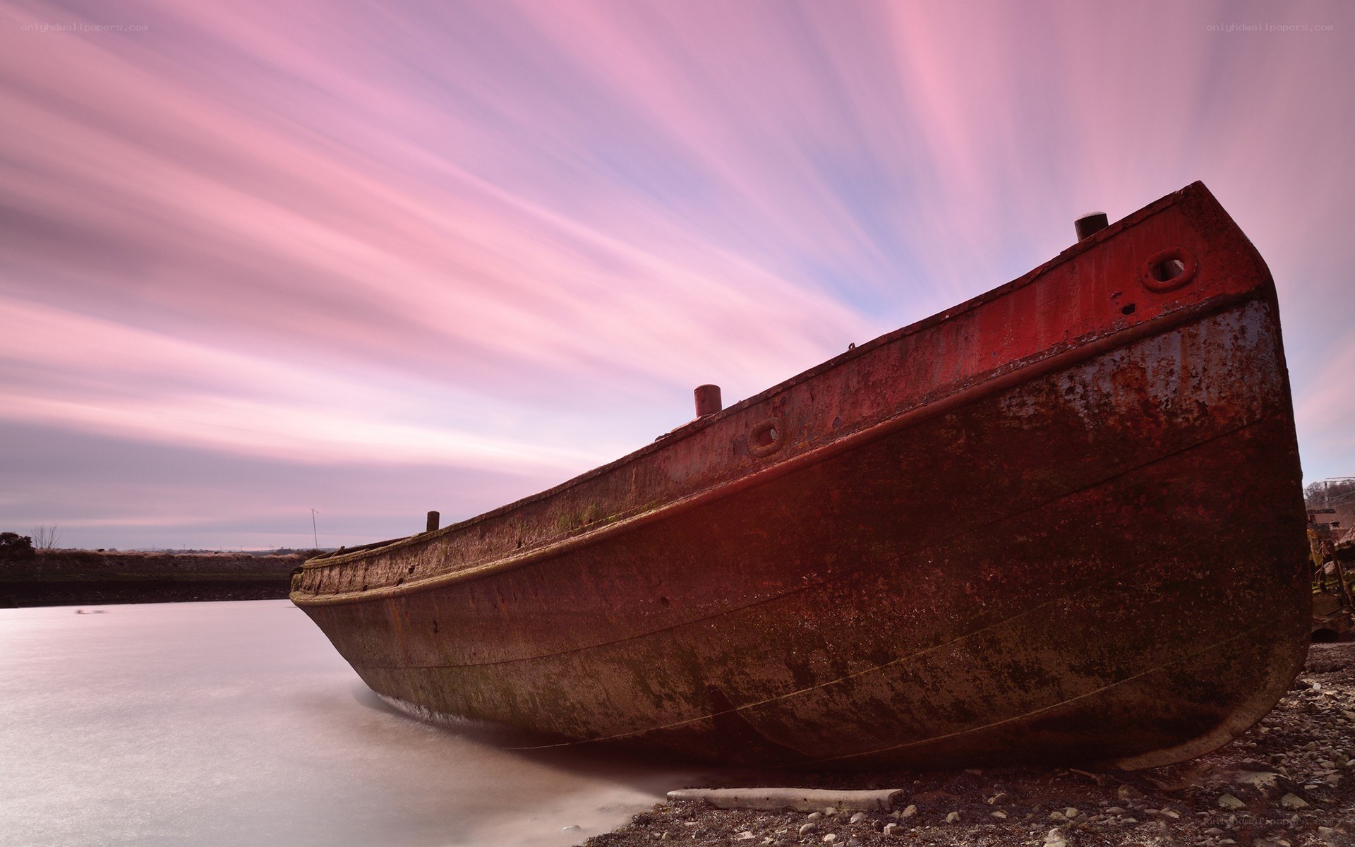 Rusty boat at sunset
