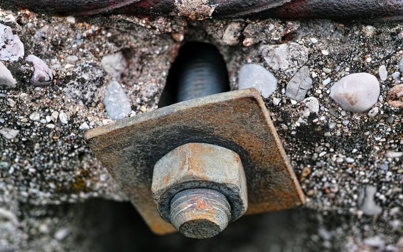 Rusty Bolt in Concrete