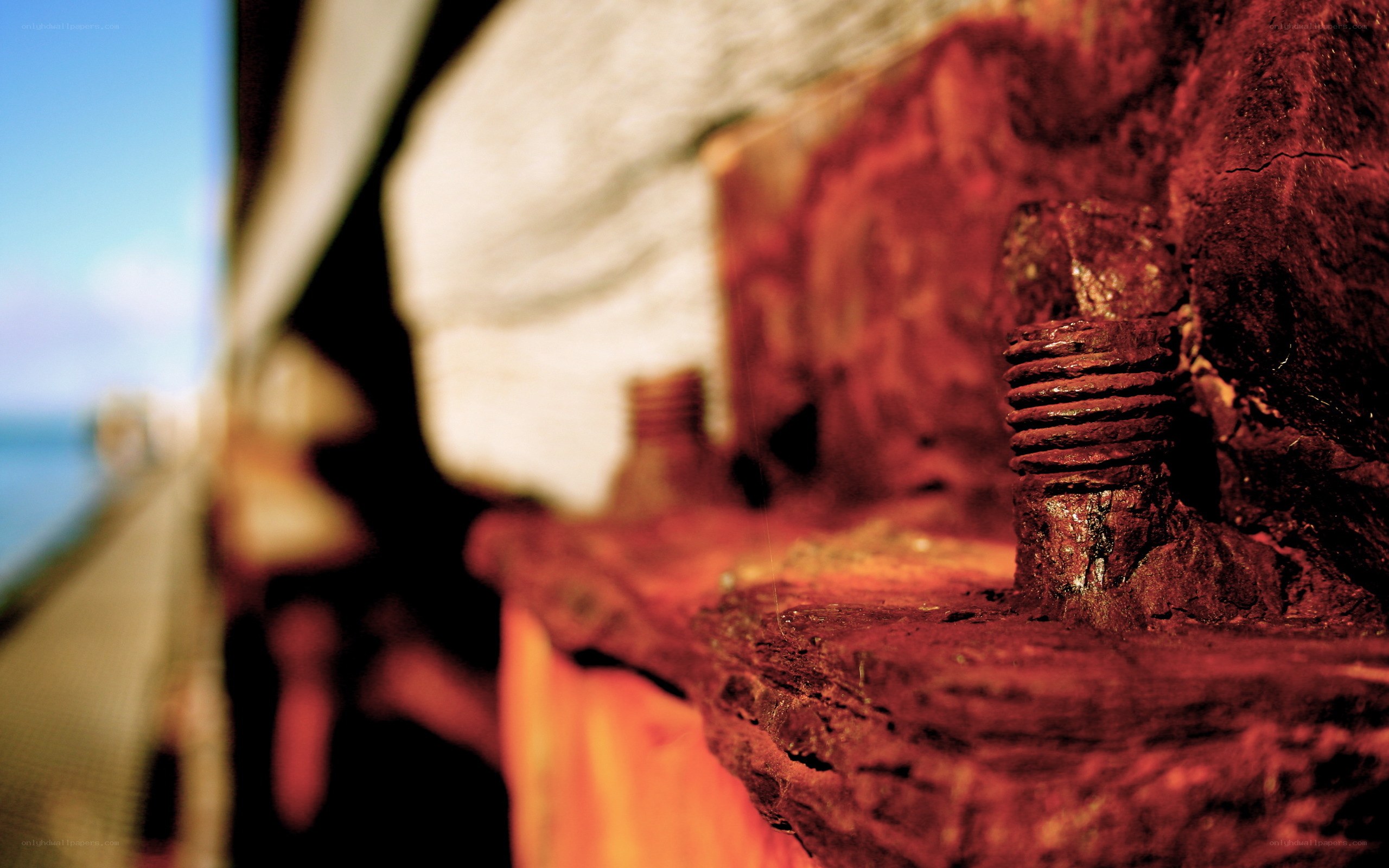 Rusty bolt on a wooden beam