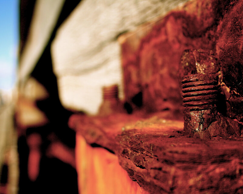 Rusty bolt on weathered wood